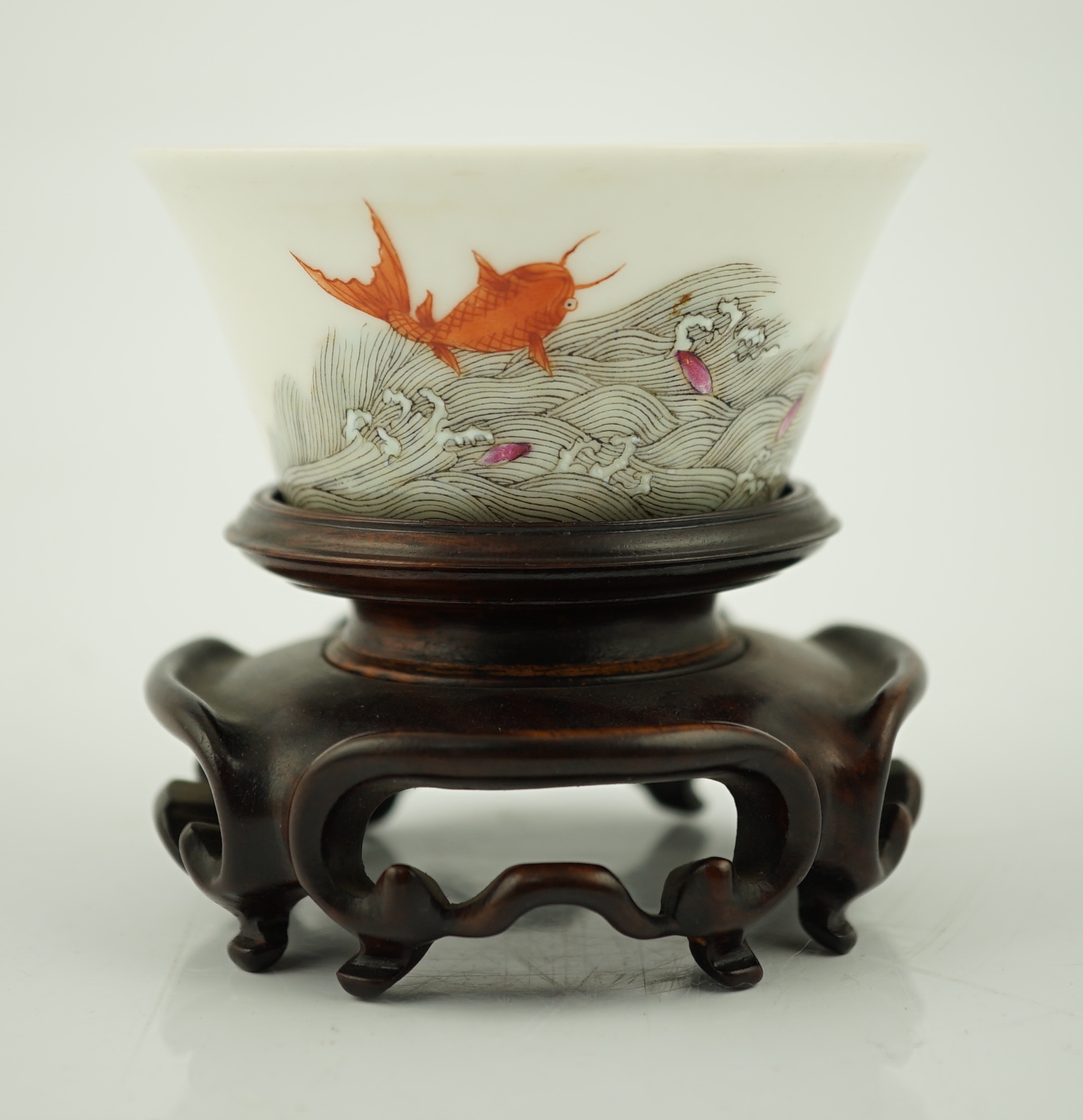 A Chinese enamelled porcelain 'leaping carp' cup, Daoguang mark and possibly of the period